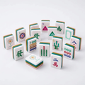 Pink Triangle American Mahjong acrylic tiles angled studio shot showing layered edges