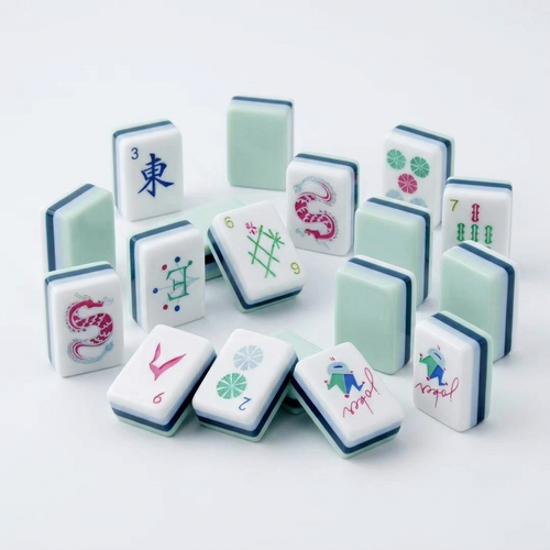 Cyan American Mahjong acrylic tiles angled studio shot showing layered edges