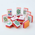 Orange Puppy American Mahjong acrylic tiles angled studio shot